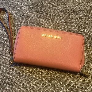 Pink Michael Kors wallet.